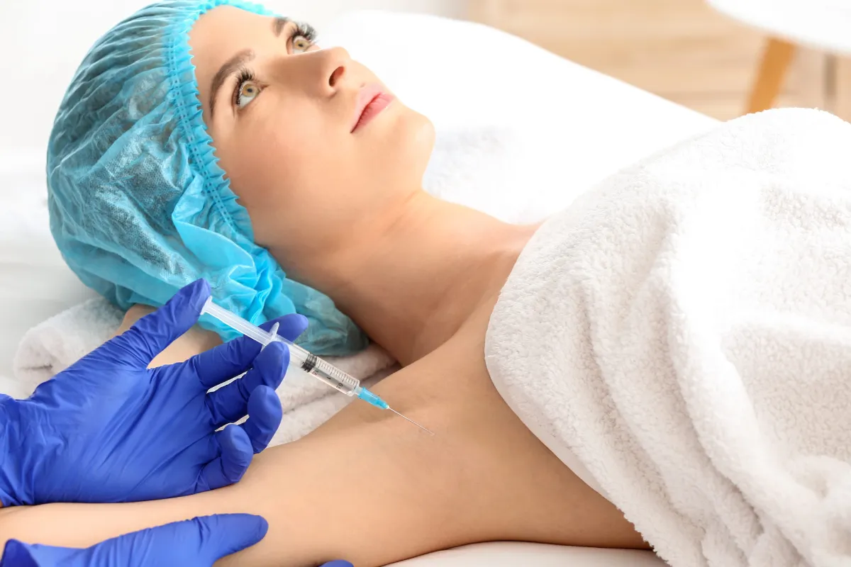 Woman receiving treatment with Botox injections for excessive underarm sweating at Amani Aesthetics